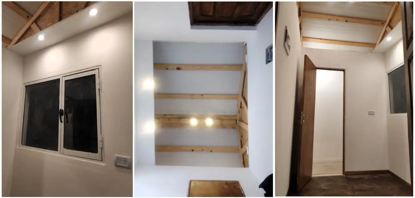 Interior de la garita terminado, con cabriadas vistas, luminarias y ventana instalada